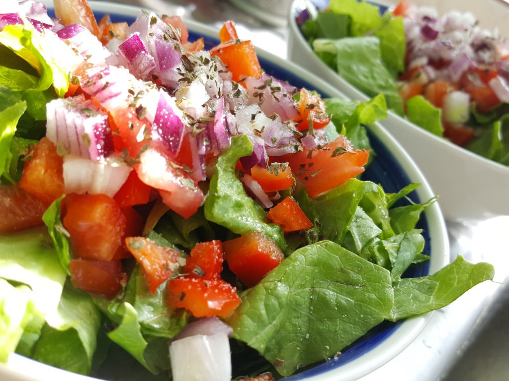 Alkaline Food Prep for Digestive Healing - Green salad with peppers, onion and tomato with key lime dressing by Crush Foster.